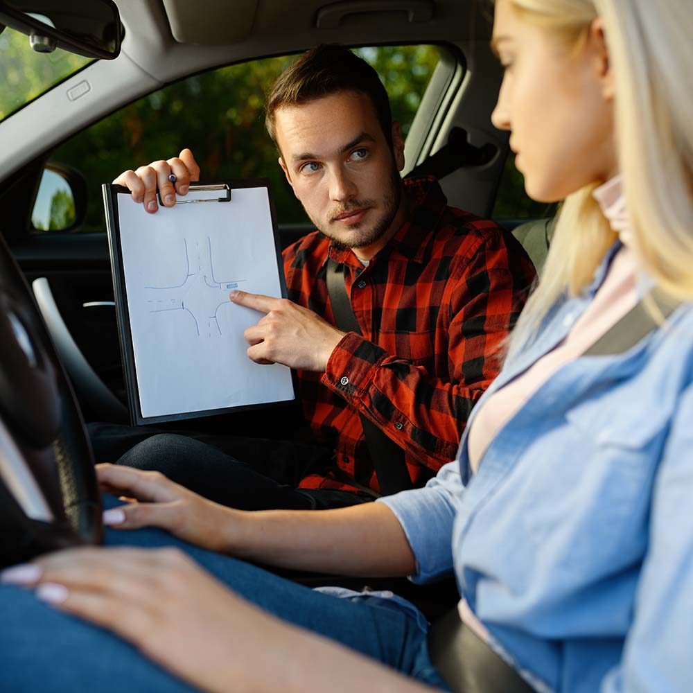 woman-and-man-with-checklist-driving-school-DLAAXGQ.jpg woman-and-man-with-checklist-driving-school-DLAAXGQ.jpg